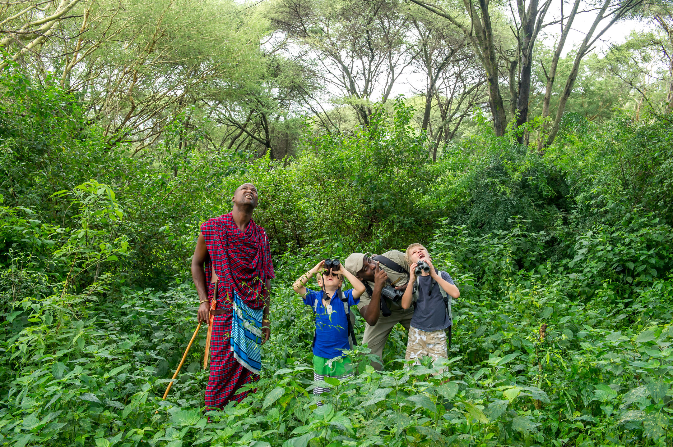 Family walking in Tanzania forest